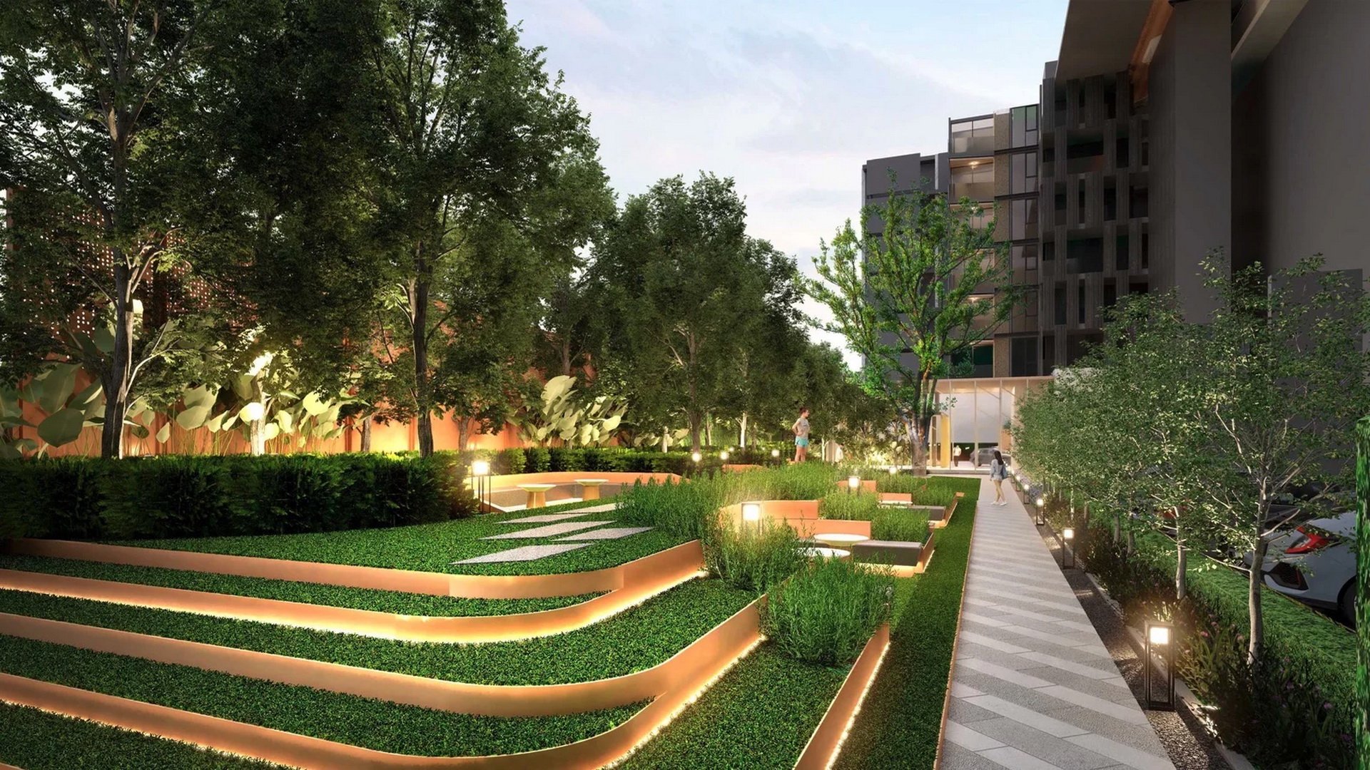 VIP Venus Karon — ландшафтный сад с террасированными газонами в вечернем освещении